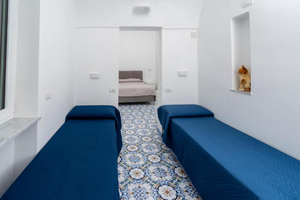 Postel nebo postele na pokoji v ubytování Guest House La Piazzetta