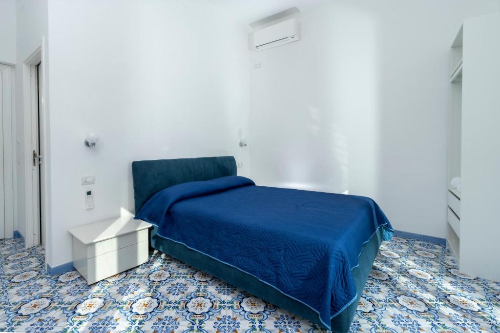 Postel nebo postele na pokoji v ubytování Guest House La Piazzetta
