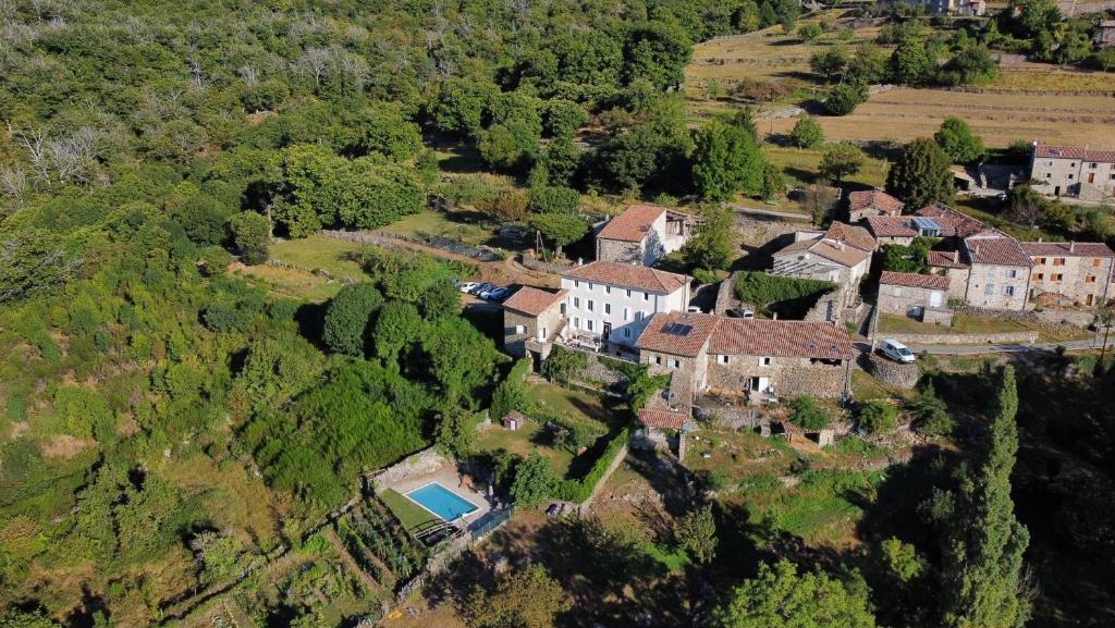 an aerial view of a house on a hill at La Ferme De Chalas in Valgorge