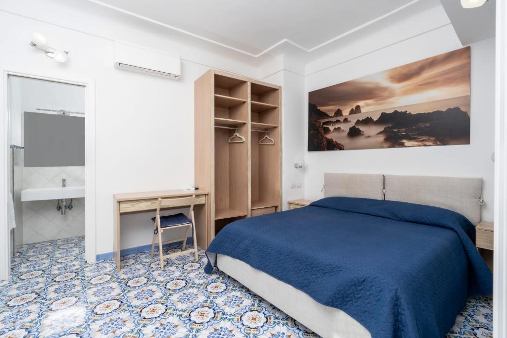 Postel nebo postele na pokoji v ubytování Guest House La Piazzetta