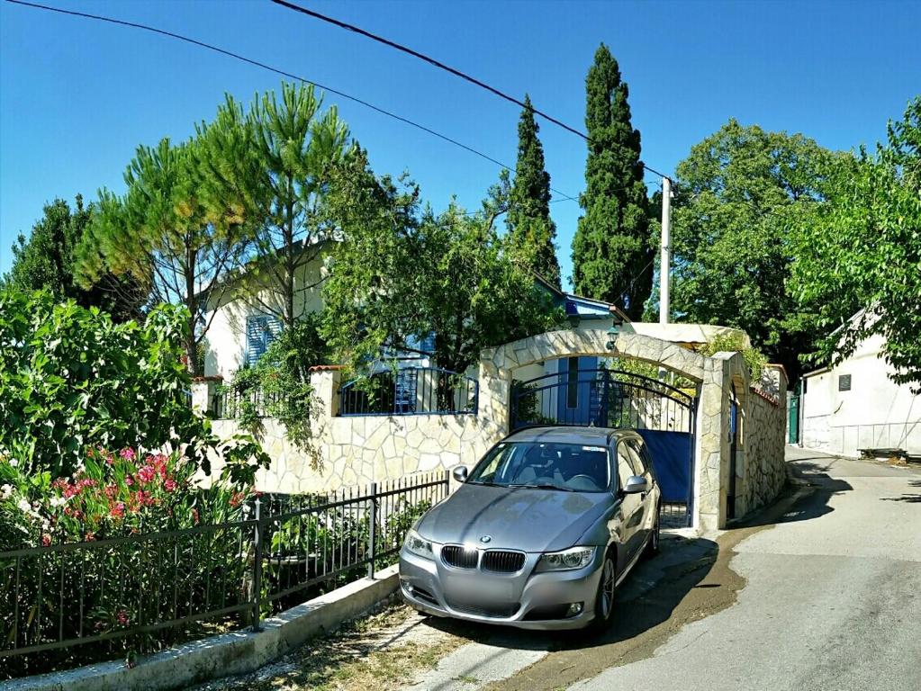 a silver car parked in front of a house at Holiday Home Adricon in Grižane