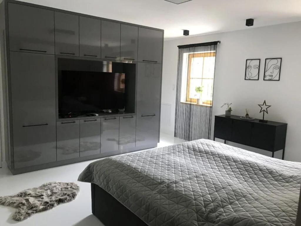 Postel nebo postele na pokoji v ubytování Vértes Gyöngye Vendégház Vérteskozma