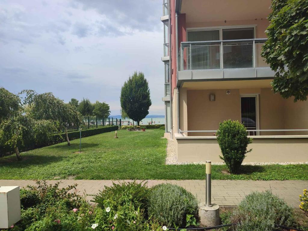 a large house with a grassy yard in front of it at Studio in Siofok - Balaton 45328 in Siófok