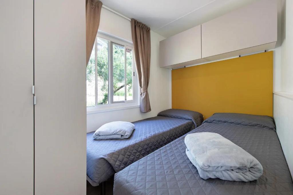 Postel nebo postele na pokoji v ubytování Camping Eurovil
