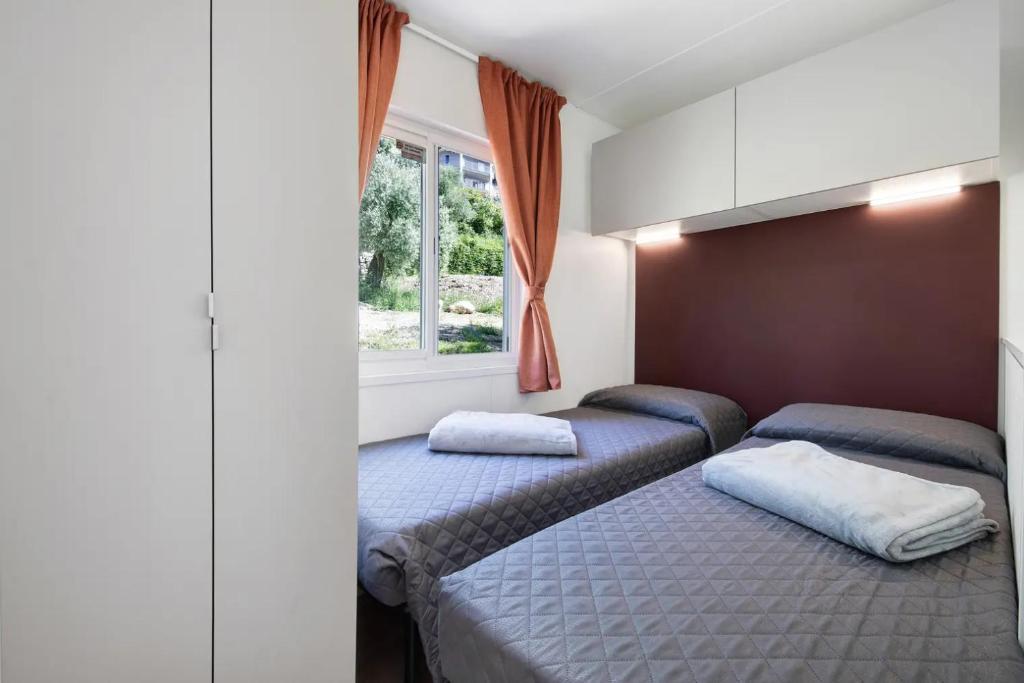 Postel nebo postele na pokoji v ubytování Camping Eurovil
