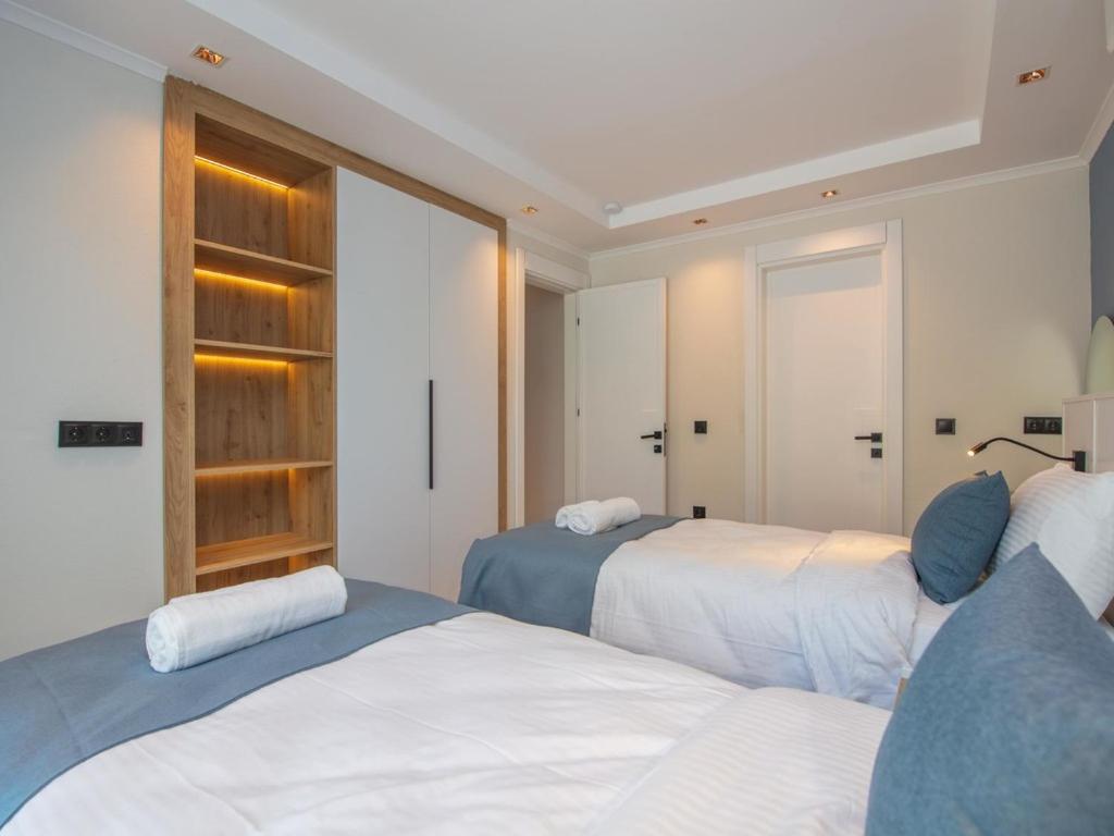 Postel nebo postele na pokoji v ubytování Asfiya Loft Apartments