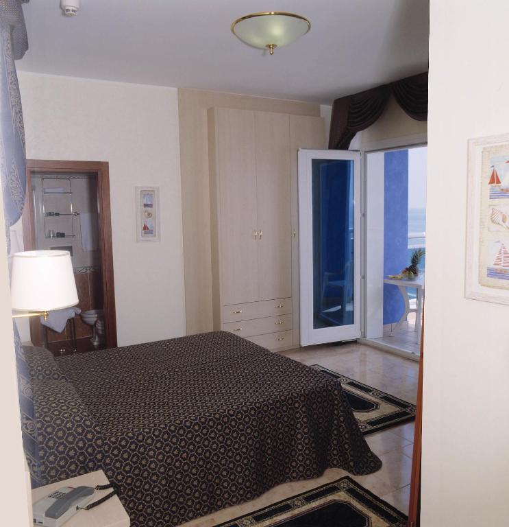 Voodi või voodid majutusasutuse Hotel Caravelle&MiniCaravelle toas