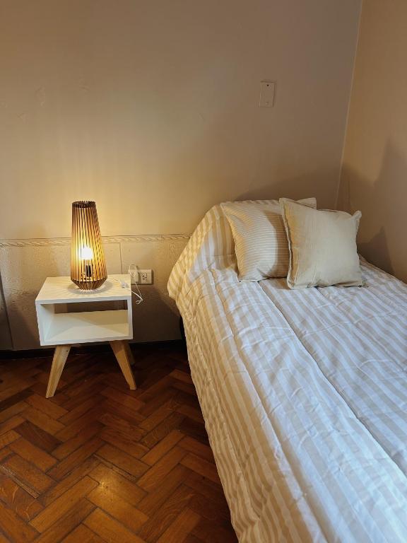 Postel nebo postele na pokoji v ubytování Casa Cedro Mendoza