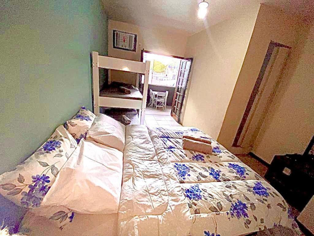 מיטה או מיטות בחדר ב-Pousada Praia do Recreio