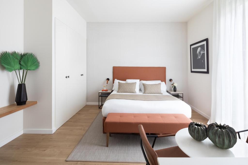 Posteľ alebo postele v izbe v ubytovaní Murmuri Residence Concepció