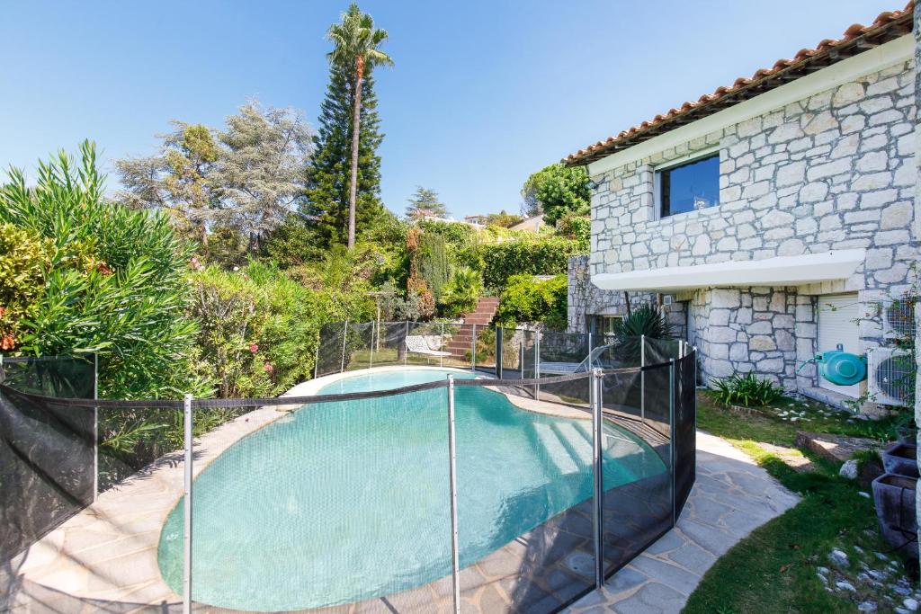 a house with a swimming pool in a yard at HSUD0085-Sansovino in Cannes