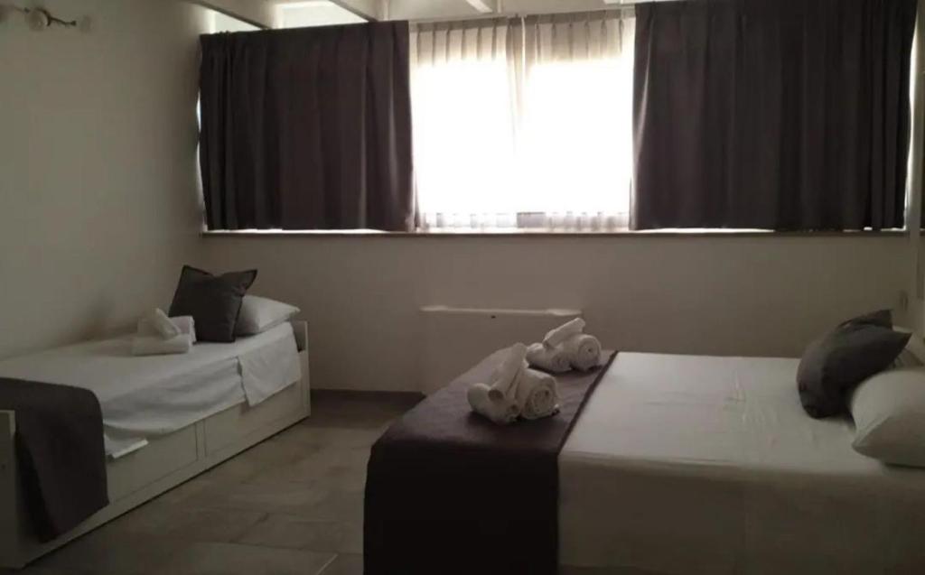 Posteľ alebo postele v izbe v ubytovaní B&B NACALUI Gallipoli