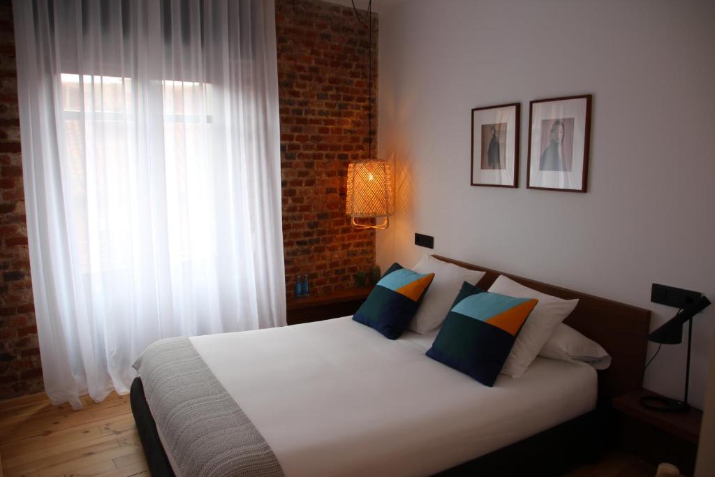 Postel nebo postele na pokoji v ubytování 13 suites