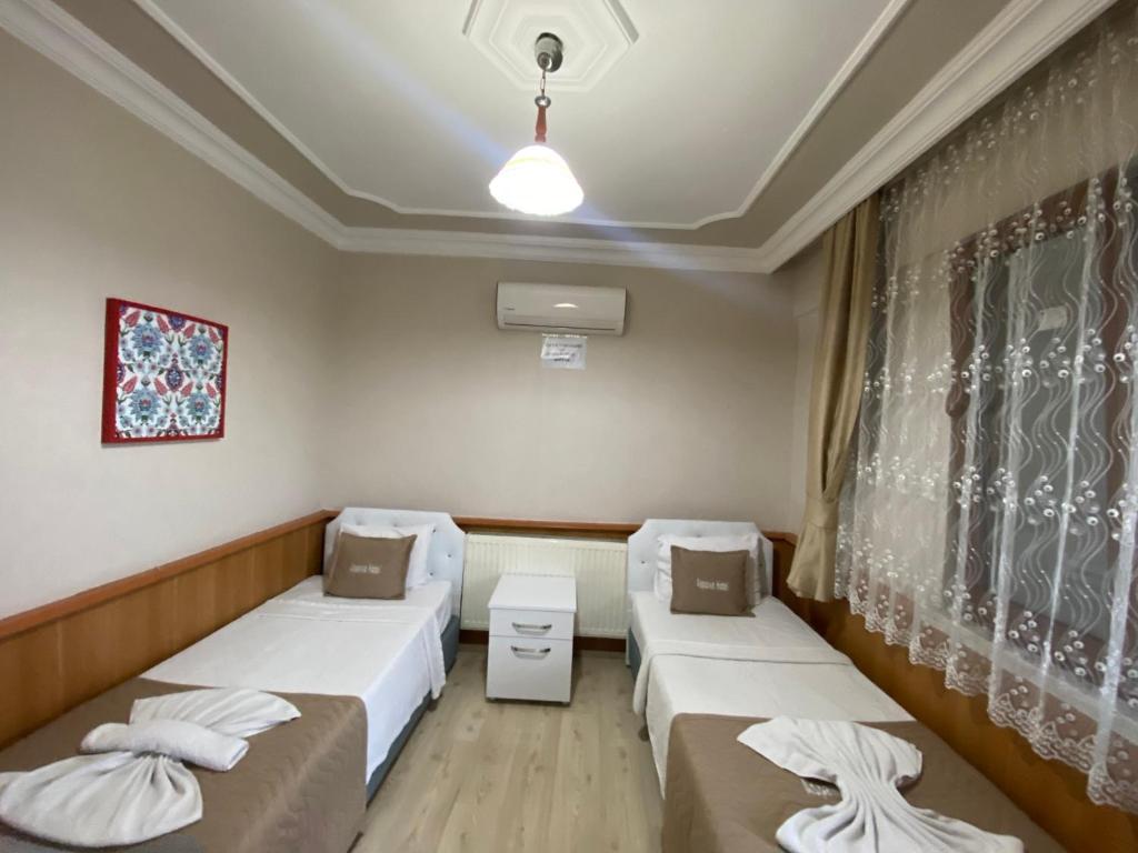 Giường trong phòng chung tại Aspawa Hotel