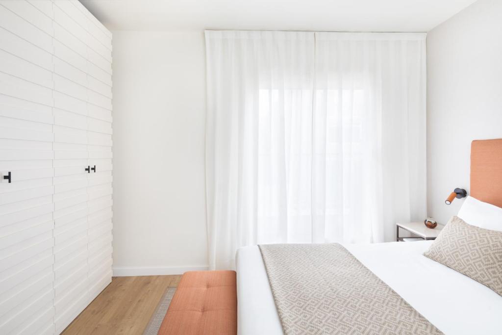 Posteľ alebo postele v izbe v ubytovaní Murmuri Residence Concepció