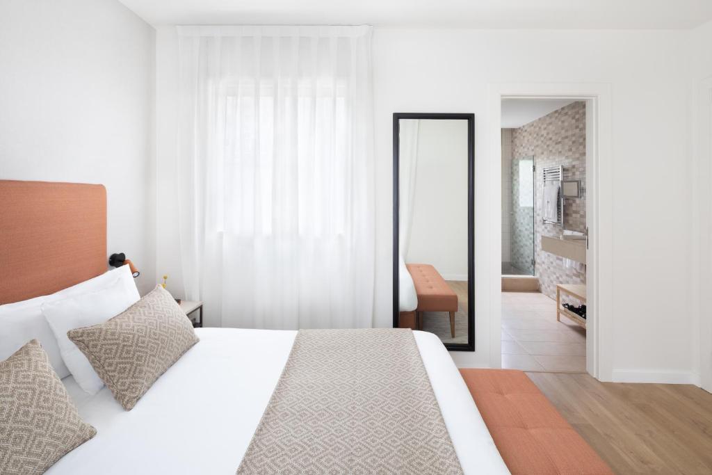 Posteľ alebo postele v izbe v ubytovaní Murmuri Residence Concepció