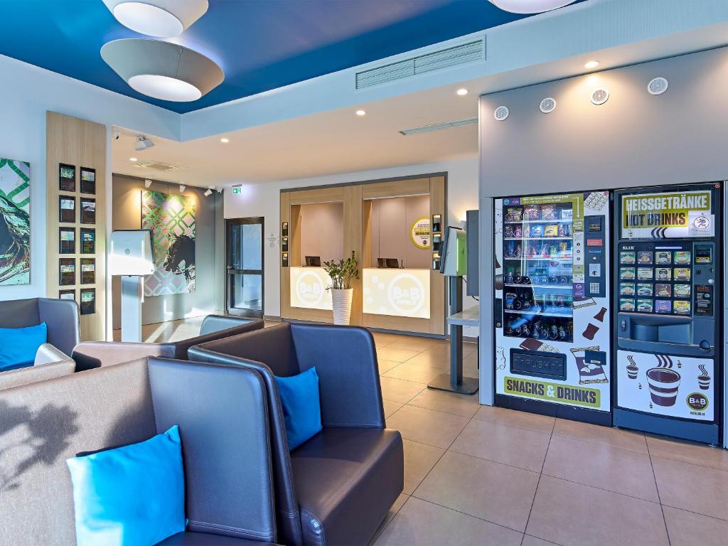 a waiting room at abucks store with blue ceilings at B&B Hotel Dortmund-City in Dortmund