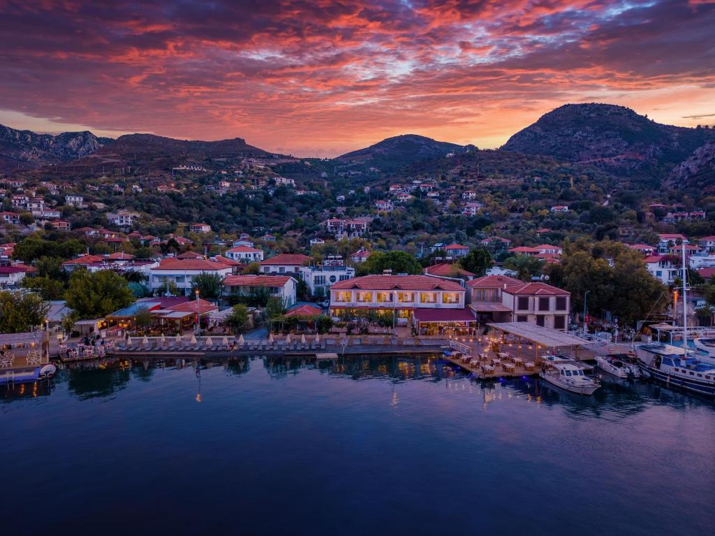 a view of a town on the water at sunset at selimiye base in Marmaris