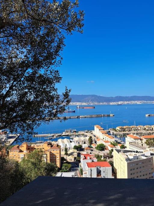 a view of a city with a large body of water at Sea View Apartment with Balcony & Beautiful Views in Gibraltar