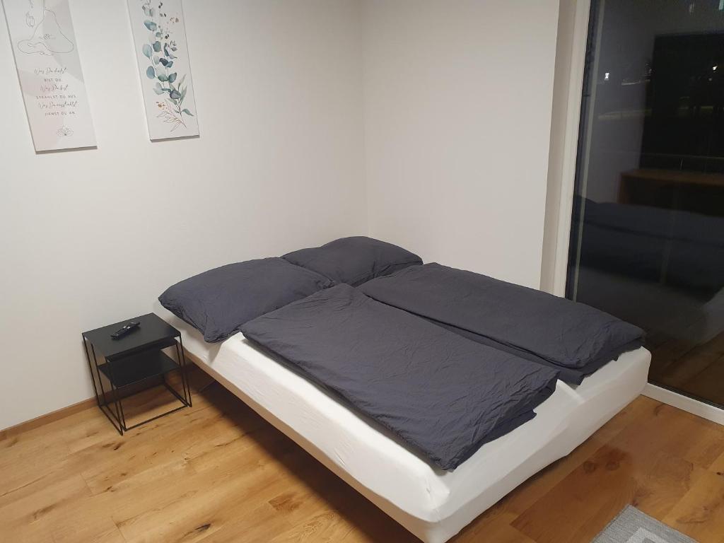Postel nebo postele na pokoji v ubytování little alpenapart