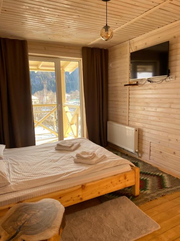 Postel nebo postele na pokoji v ubytování Chalet Ivanna