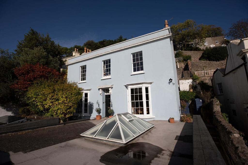 a white house with a ramp in front of it at Mount Lebanon in Clevedon