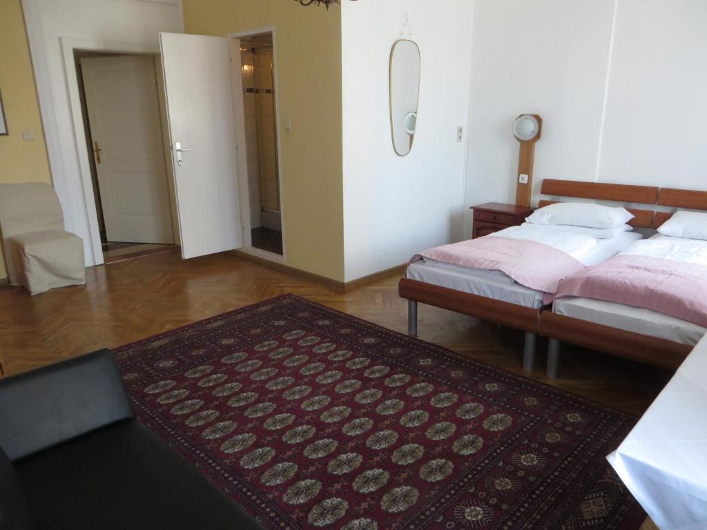 Postel nebo postele na pokoji v ubytování Hotel Stadtpark