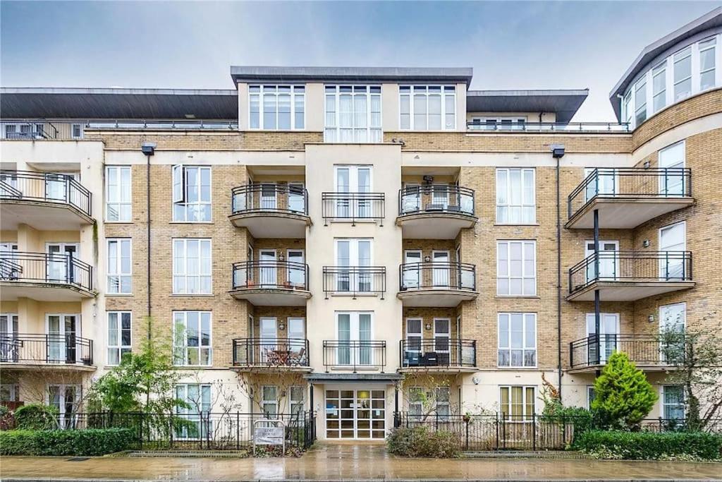 an apartment building with balconies on the side of it at Entire 1 bed apartment-Convenient and peaceful amenable stay in London