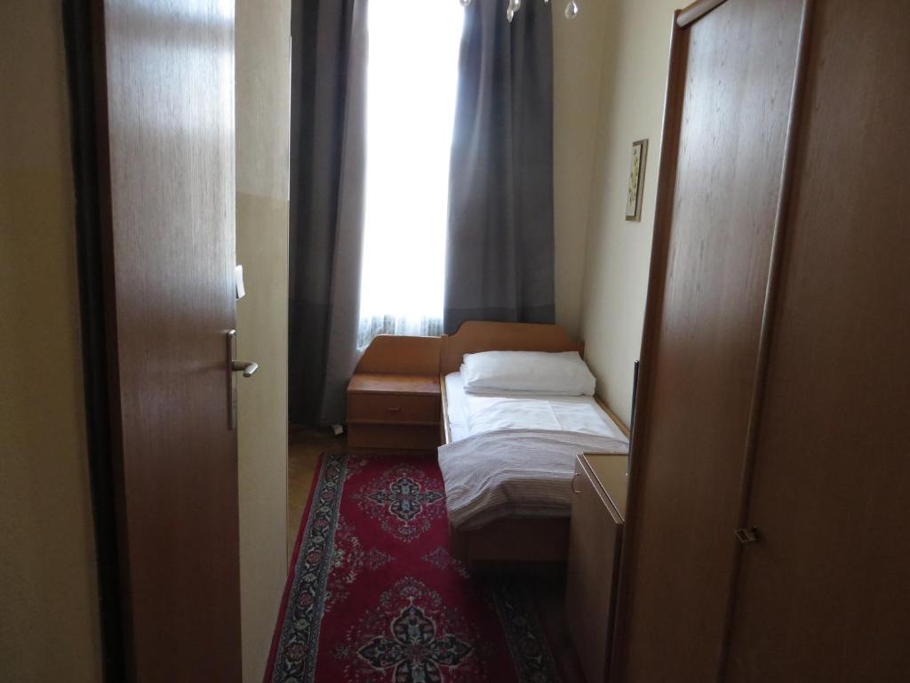 Postel nebo postele na pokoji v ubytování Hotel Stadtpark