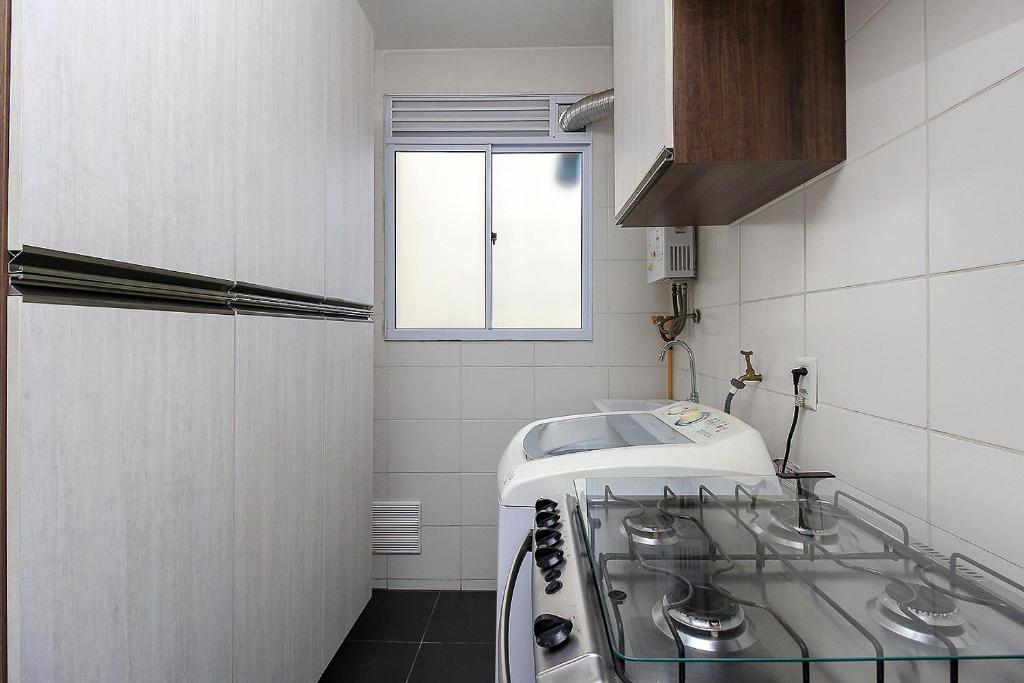 Kuchyň nebo kuchyňský kout v ubytování Ap Cloe com piscina próximo ao Aeroporto