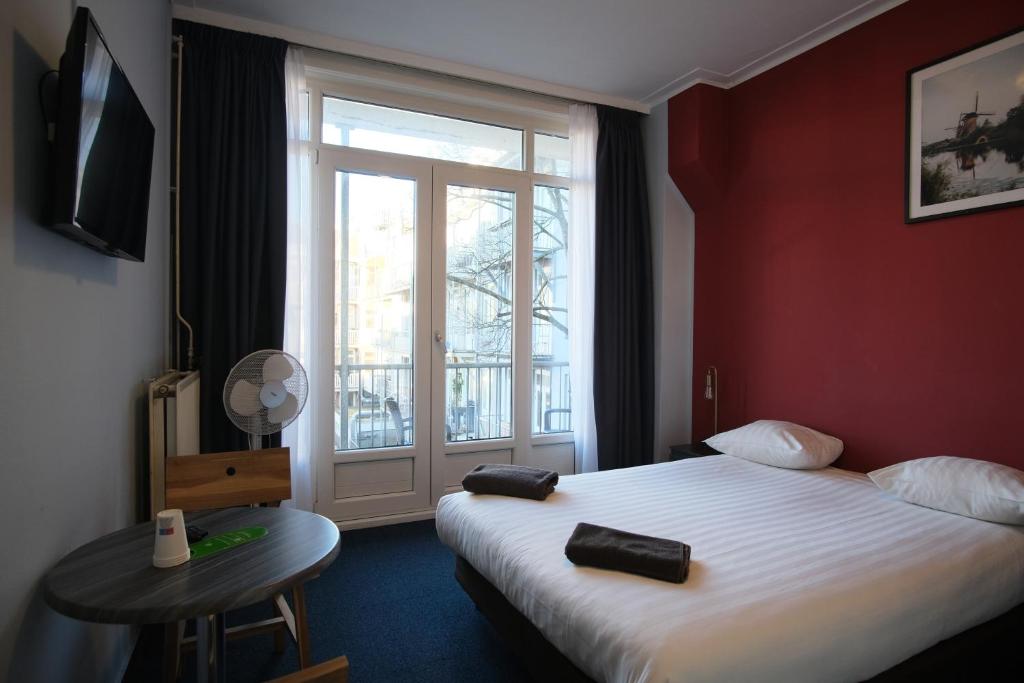Postel nebo postele na pokoji v ubytování Hotel Abba