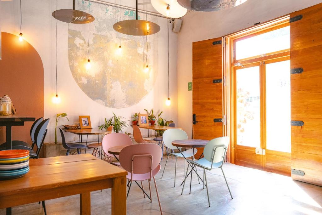 a restaurant with tables and chairs in a room at Casa Tunido in Santa Marta