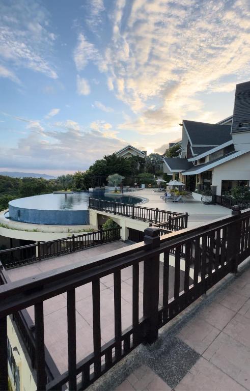 a resort with a swimming pool and a fence at H 109, Alta Vista De Boracay in Boracay