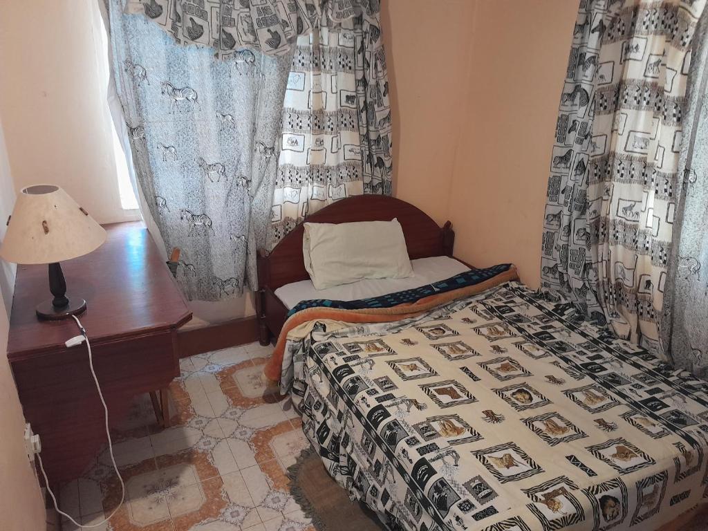 Postel nebo postele na pokoji v ubytování Entim Guest House