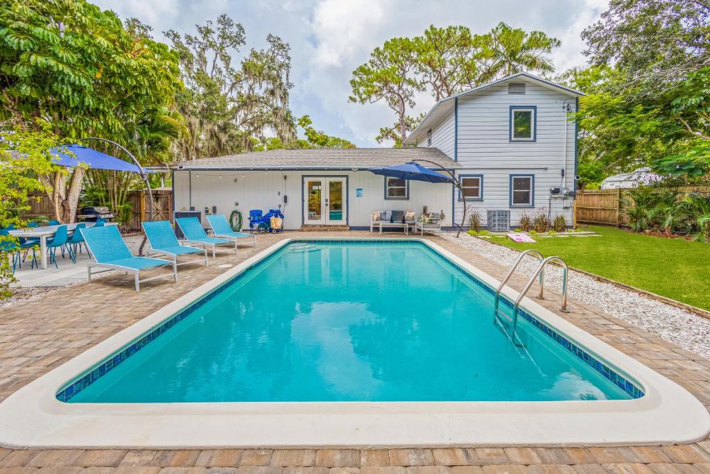 a swimming pool in front of a house at Private Heated Pool - Arcade - Pets - 2 King Beds in Bradenton