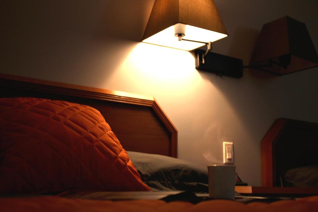 Postel nebo postele na pokoji v ubytování Hôtel Val-des-Sources