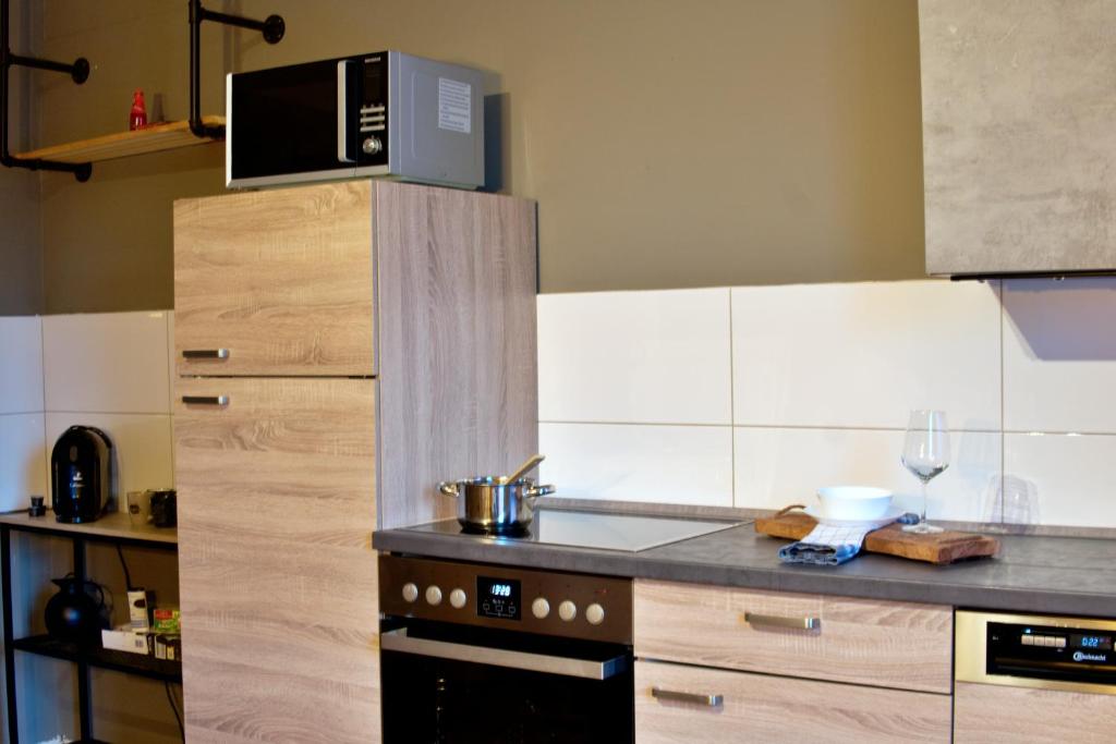 Kuchyň nebo kuchyňský kout v ubytování Industrial Style 77qm mit Balkon