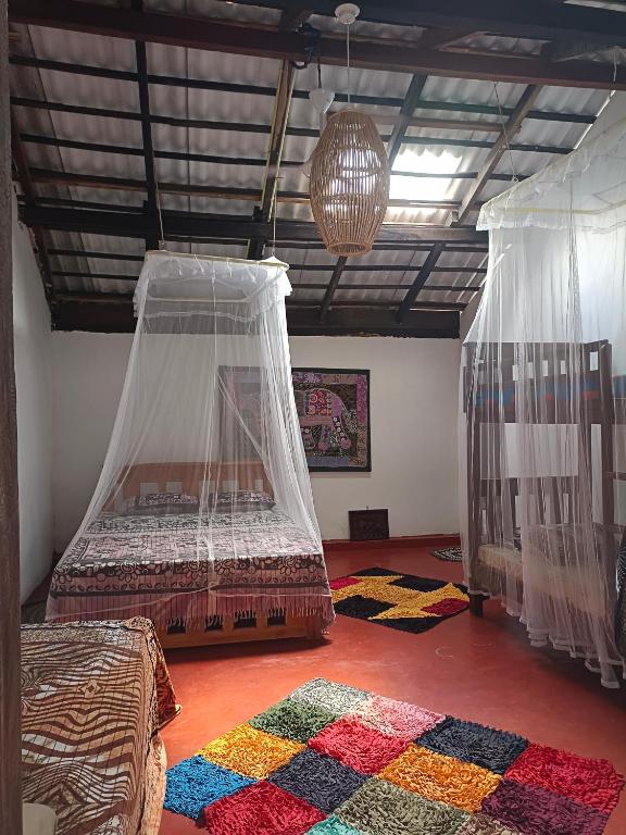 Postel nebo postele na pokoji v ubytování Mamisa Café, Home stay