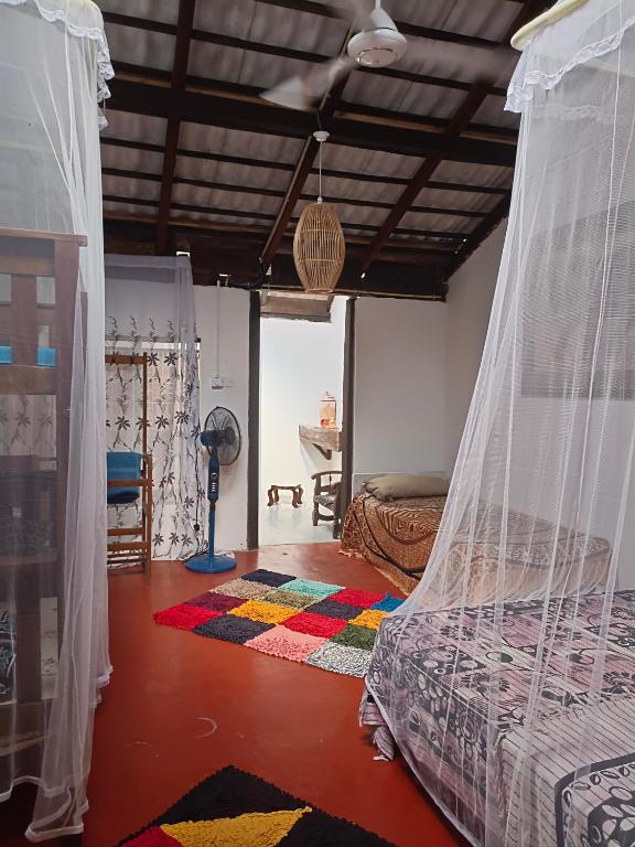 Postel nebo postele na pokoji v ubytování Mamisa Café, Home stay