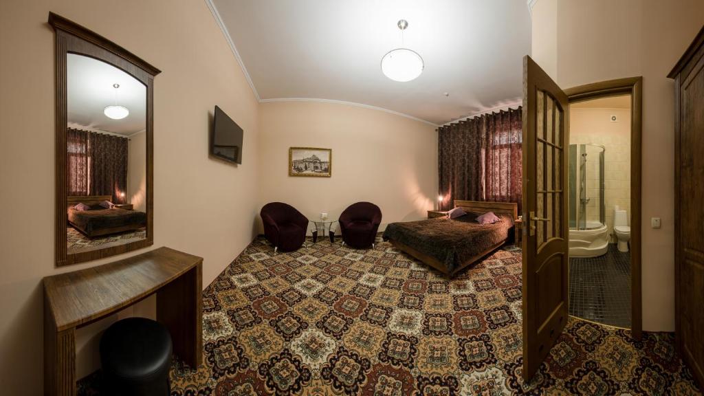 Postel nebo postele na pokoji v ubytování Premium Hotel