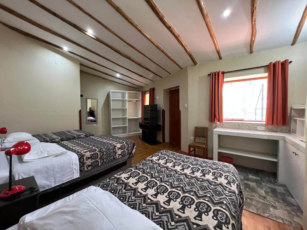 Postel nebo postele na pokoji v ubytování Anka Wasi Lodging