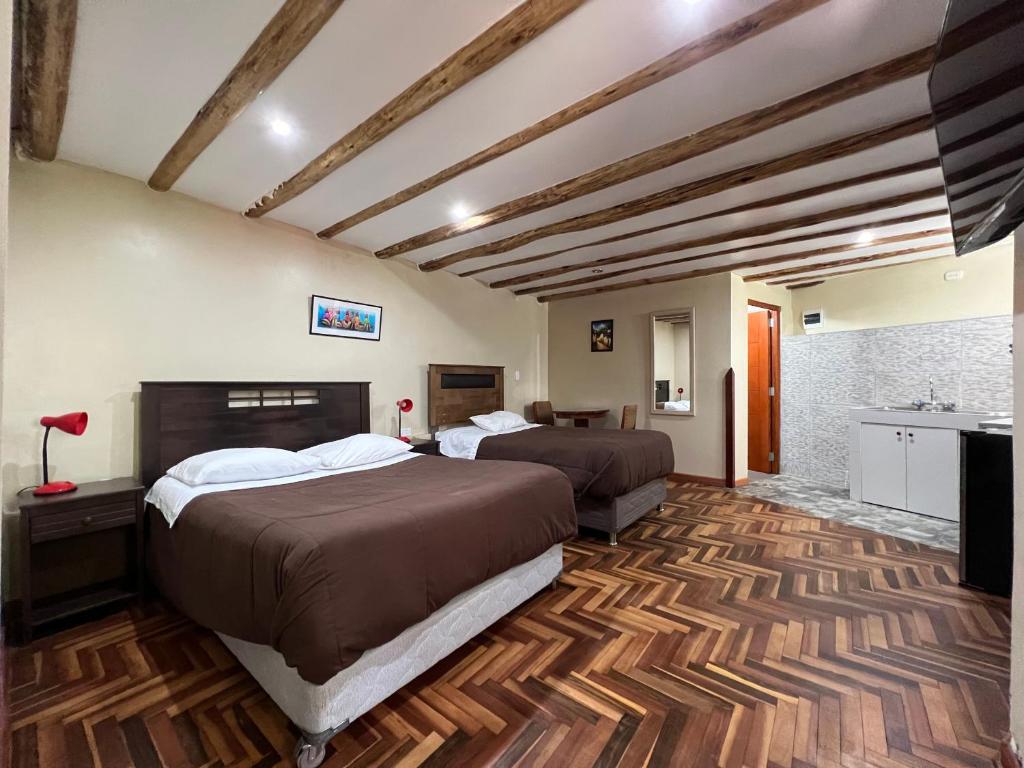 Postel nebo postele na pokoji v ubytování Anka Wasi Lodging
