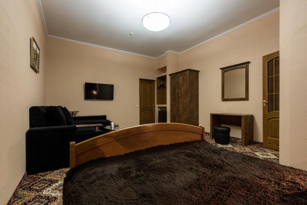 TV a/nebo společenská místnost v ubytování Premium Hotel