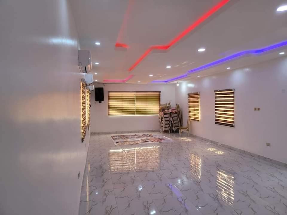 a room with a white wall with a red line on the ceiling at B&Y ROYAL BAR & LOUNGE ADIGBE ROAD ABEOKUTA NEAR ADIGBE POLICE STATION AFTER PANSEKE in Abeokuta