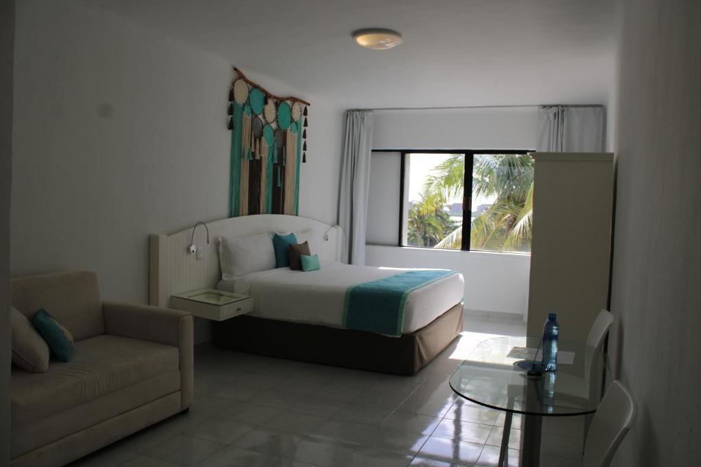 Postel nebo postele na pokoji v ubytování Cyan Cancun Resort & Spa