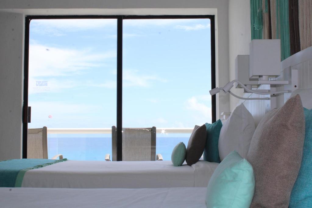 Postel nebo postele na pokoji v ubytování Cyan Cancun Resort & Spa