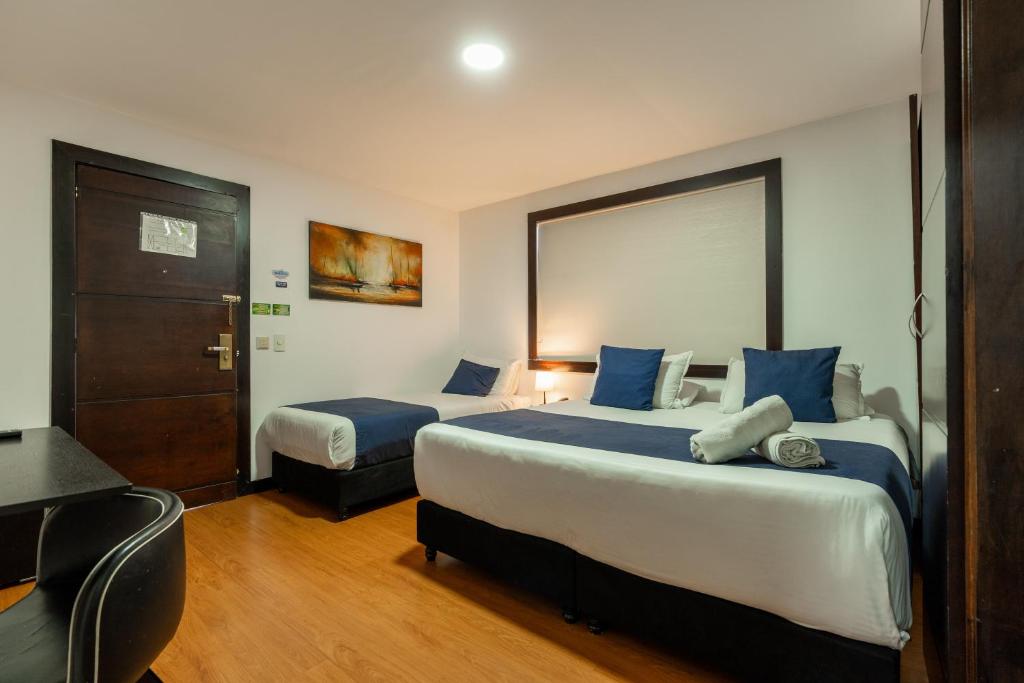 Postel nebo postele na pokoji v ubytování Hotel Bogota Resort