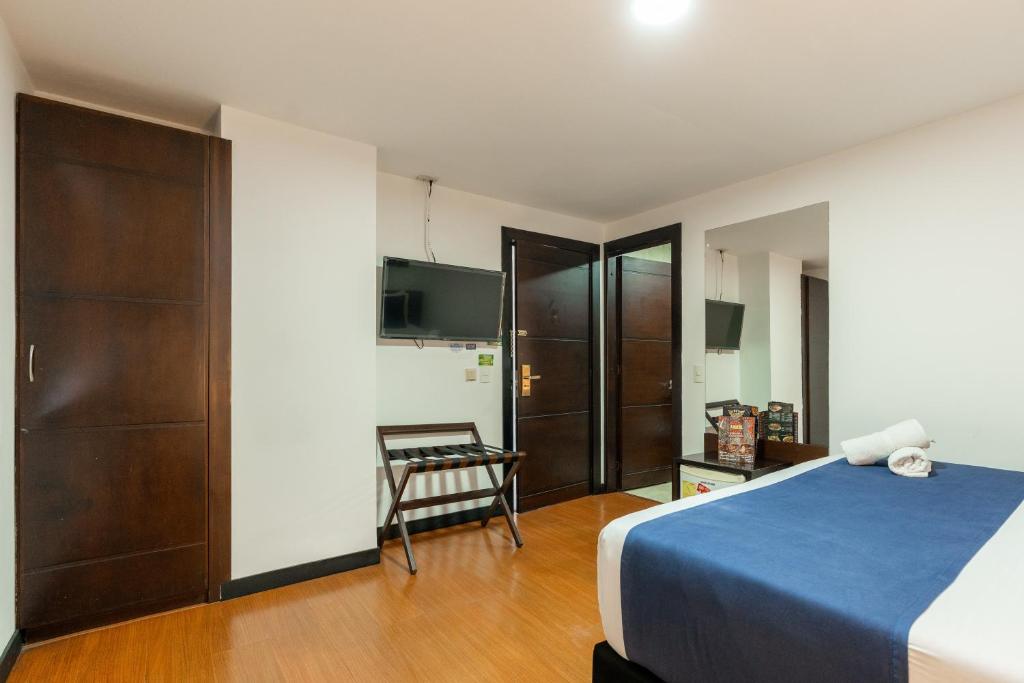 Postel nebo postele na pokoji v ubytování Hotel Bogota Resort