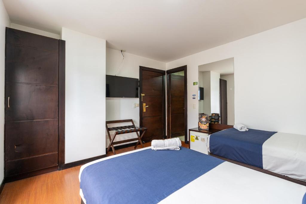 Postel nebo postele na pokoji v ubytování Hotel Bogota Resort