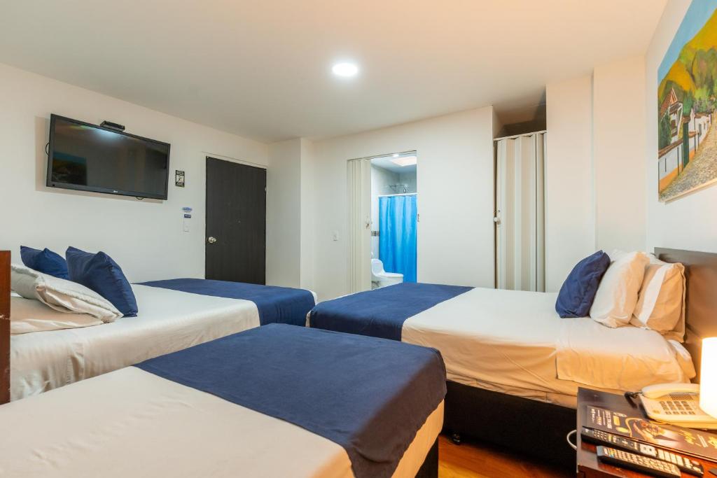 Postel nebo postele na pokoji v ubytování Hotel Bogota Resort